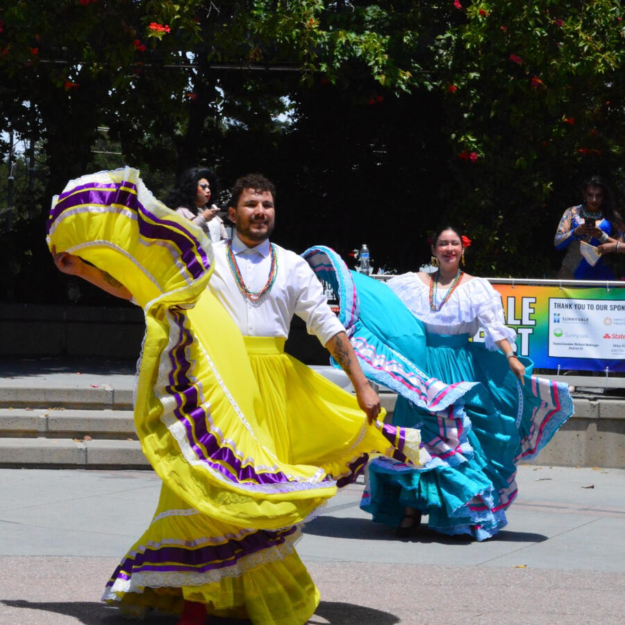 Folklorico Folklorico dancers of multiple genders in traditional dresses